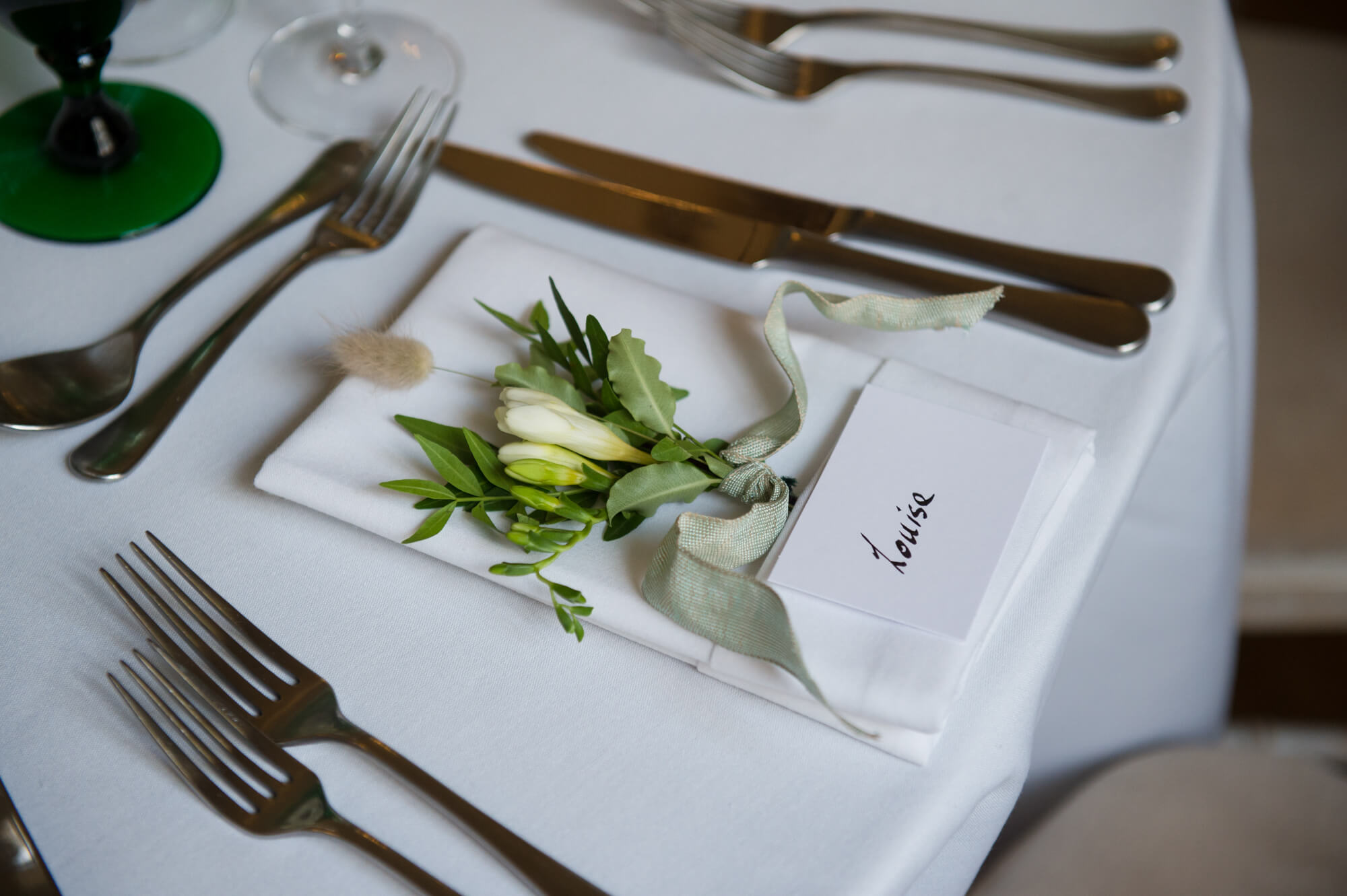 A beautiful table setting with wedding flowers by Jane Lawrence